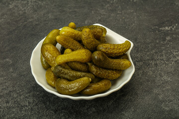 Pickled gherkin in the bowl