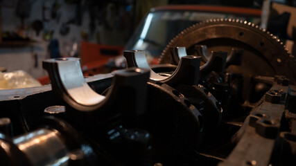Car repair. The car parts lie on the internal combustion engine. Crankset crankshaft