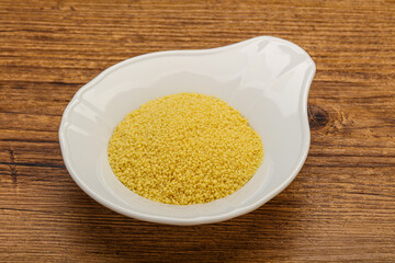 Raw cous cous heap in the bowl
