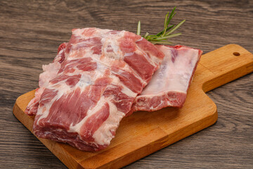 Raw pork ribs served rosemary