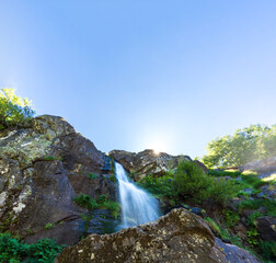 Bottom view long exposure of waterfall and sunstar