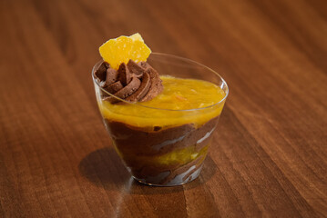 Chocolate panna cotta with orange in glass