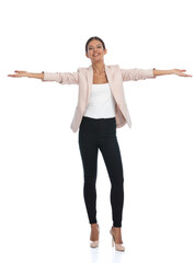 excited young woman smiling and opening arms