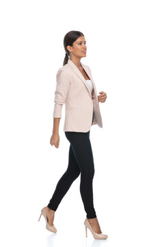 Side View Of Smart Casual Woman Confidently Walking