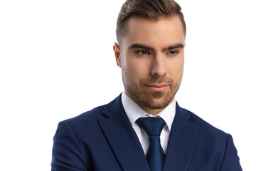 close up of elegant fashion model in navy blue suit looking to side
