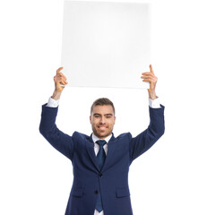 enthusiastic young guy showing empty board and smiling