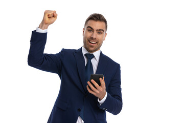 enthusiastic businessman holding fists in the air and celebrating