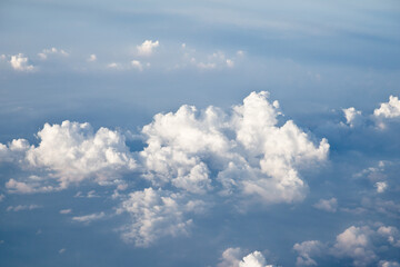 Aerial view of Blue sky and Cloud Top view from airplane window,Nature background. Sky and clouds.