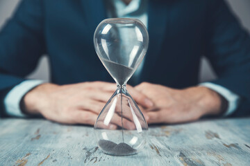 young business man with hourglass