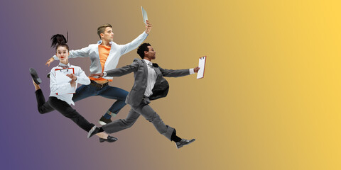 Fototapeta na wymiar Yellow grey. Happy office workers jumping, dancing in casual clothes or suit isolated on gradient neon fluid background. Business, start-up, working open-space, motion, action concept. Creative