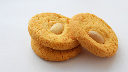 Round whole and half oatmeal cookies with nuts isolated on white background. Sweet cookies. Bakery products. Place for text. Top view. Homemade oatmeal cookies group, selective focus