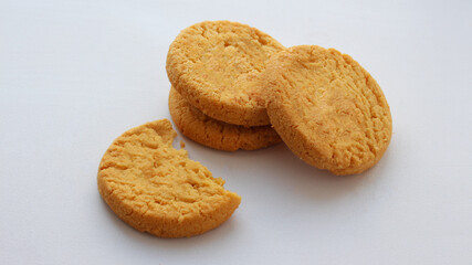 Group of round crispy cookies isolated on white background. Sweet cookies. Bakery products. Place for text, selective focus