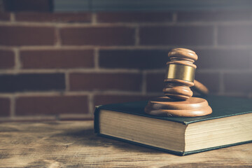 Judges gavel and law book on the table