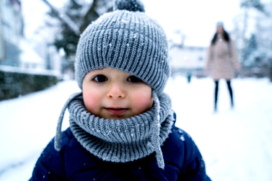 winter close up outdoor portrait of adorable dreamy baby