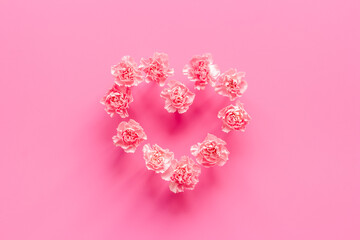 Heart shape of pink flowers. Valentines Day, wedding or birthday background