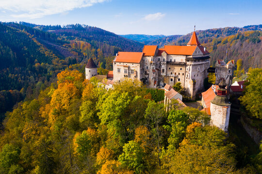 Scenic aerial view of impressive medieval Pernstejn castle on sunny autumn day, South Moravian Region, Czech Republic