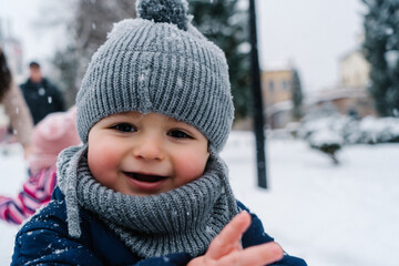 winter close up outdoor portrait of adorable dreamy baby