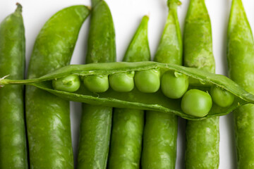 green pea pod, green peas, white background