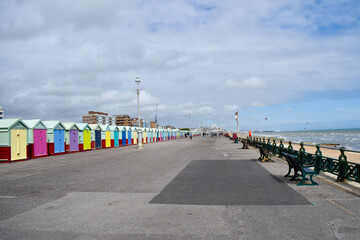 Row of colourful beach huts on Hove seafront, UK