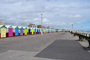 A row of beach huts along Hove seafront, UK