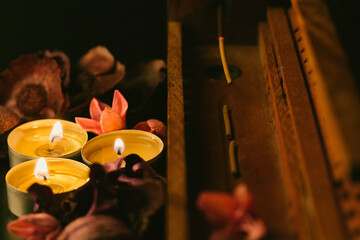 incense stick aroma with smoke  with dried petals and candles