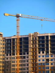 Construction site. Building site with crane. Concrete building under construction