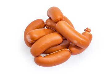 Pile of the uncooked short thick sausages on a white background