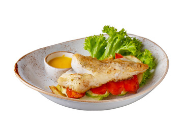 Halibut steak with vegetables isolated on white background.