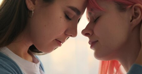 Loving female gay woman touching girlfriend with tenderness