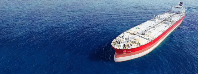 Aerial drone ultra wide photo of latest technology in safety standards crude oil tanker anchored in...