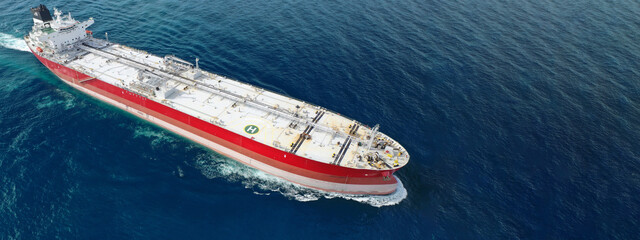 Aerial drone ultra wide panoramic photo of huge crude oil tanker cruising in deep blue sea