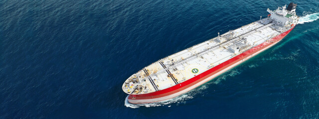 Aerial drone ultra wide panoramic photo of huge crude oil tanker cruising in deep blue sea