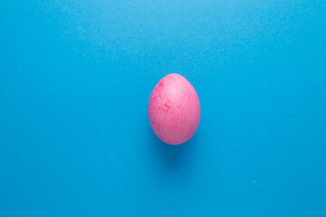 Golden egg on a blue background close-up. Easter Egg.