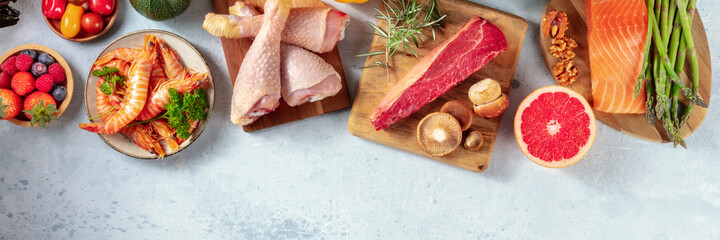 Food panorama with copy space. Meat, fish, poultry and seafood with fruit and vegetables, top shot
