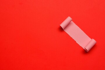 Torn paper with red paper background. Valentine's Day concept