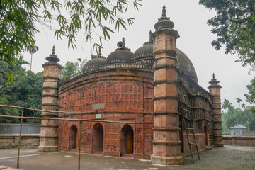 Side view of ancient Atiya or Atia mosque with stunning terracotta facade in Tangail district, Bangladesh