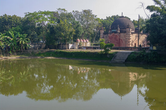 Beautiful ancient Atiya or Atia mosque view from the back with reflection in pond, Tangail district, Bangladesh