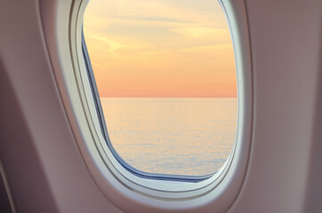 View from plane window at sunset