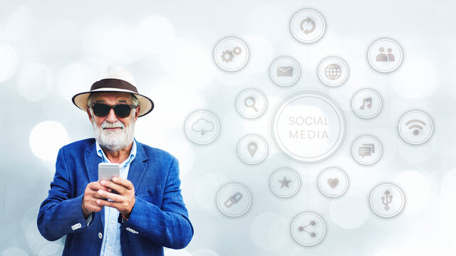 Stylish elderly man using his smartphone