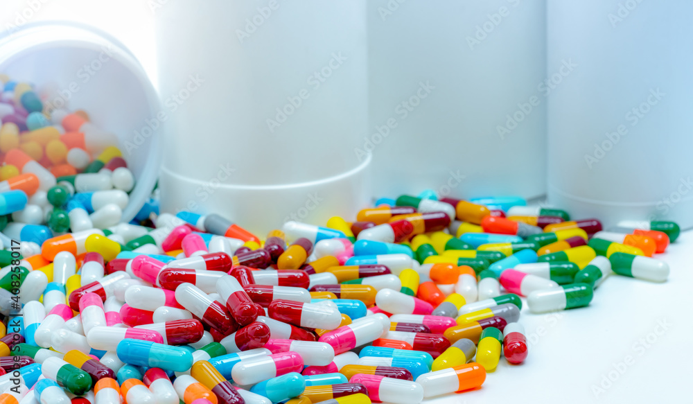 Canvas Prints pile of antibiotic capsule pills with plastic bottle. antibiotic drug resistance. antimicrobial drug