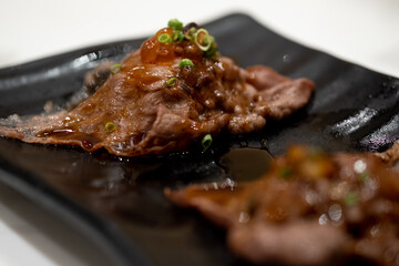 Wagyu beef sushi topped with salmon roe and sliced ​​spring onions