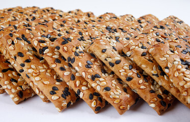 A stack of cookies with black and white sesame.