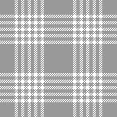 Fototapeta na wymiar Plaid pattern background in grey and white. Seamless textured check plaid graphic for flannel shirt, skirt, blanket, throw, duvet cover, or other modern spring, autumn, winter fabric design.