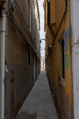 Obraz na płótnie Canvas typical Venetian street. narrow street of venice