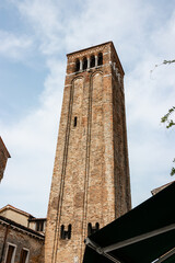 Fototapeta na wymiar medieval tower of the Cathedral of Santa Maria Gloriosa dei Frari in Venice