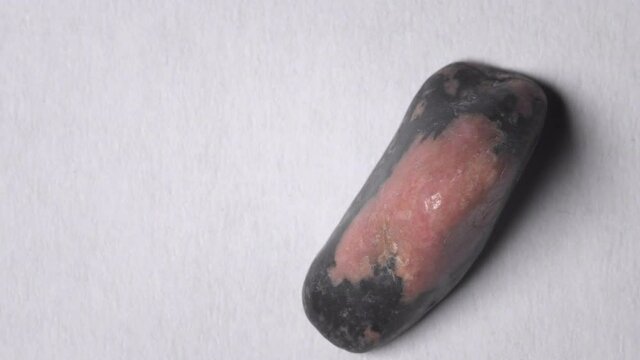 Rhodonite gemstone on turn table