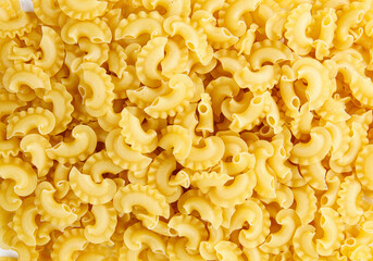 Pasta background. The pasta is filled with an even layer.