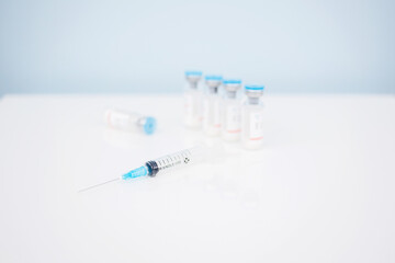 Vaccination, covid, syringe and amula layout