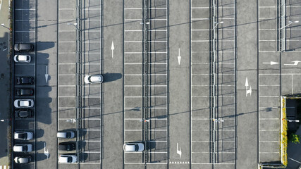Fototapeta na wymiar Top View Aerial Drone Shot: Half Empty Parking Lot