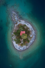 tiny red house on a island